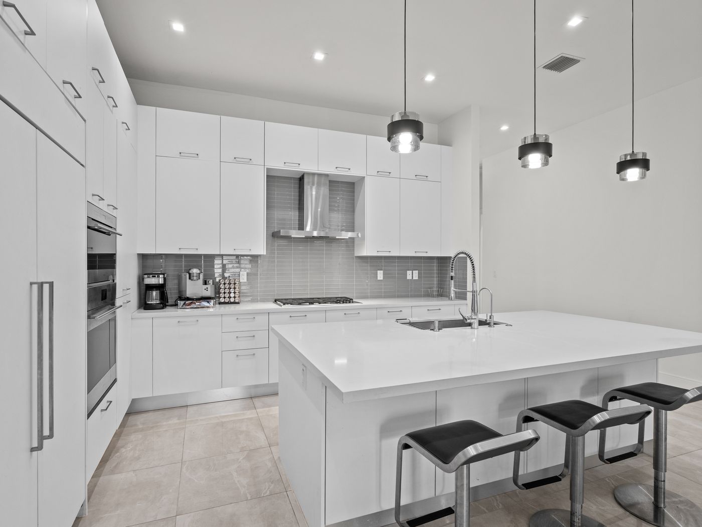 Chef's kitchen in a luxury home in Canarias at Downtown Doral